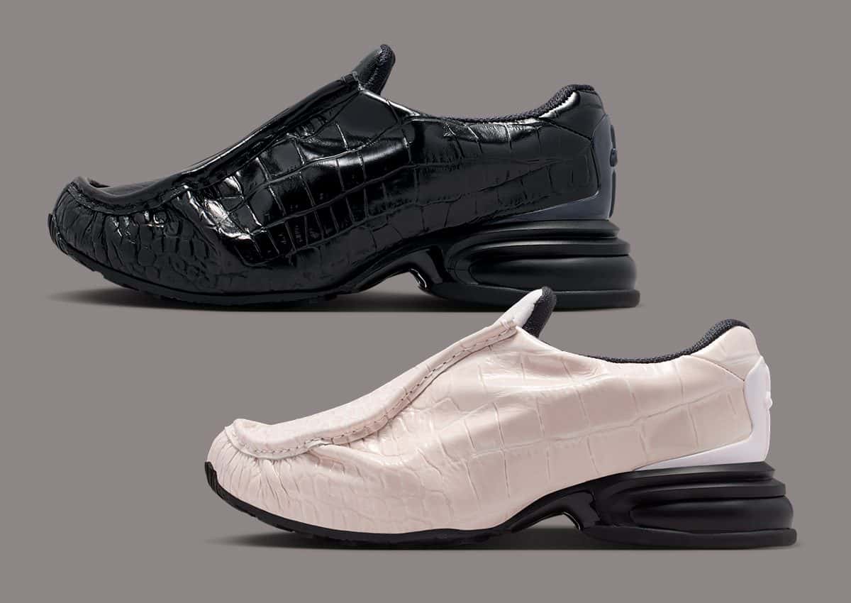 Nike Air Max Dolce Leather en cuero con textura de cocodrilo, una negra arriba y una rosa perla abajo, sobre fondo gris