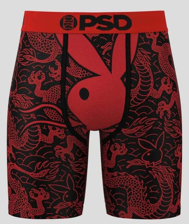 Bóxer PSD x Playboy Dragon con estampado de dragones rojos sobre negro, conejo de Playboy rojo al frente y cintura roja con logo PSD